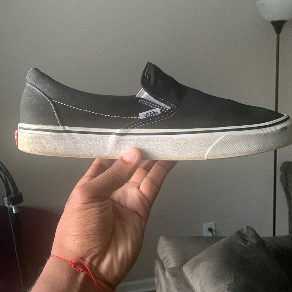 selling a pair of slip on vans. black and white. good condition
